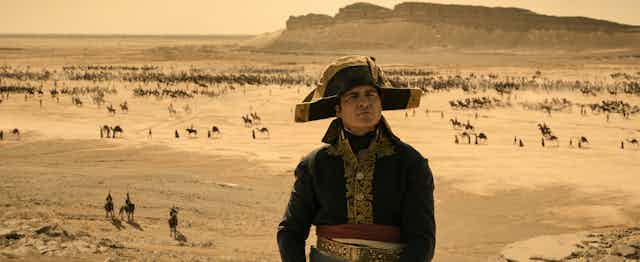 Joaquin Phoenix as Napoleon in the desert. 