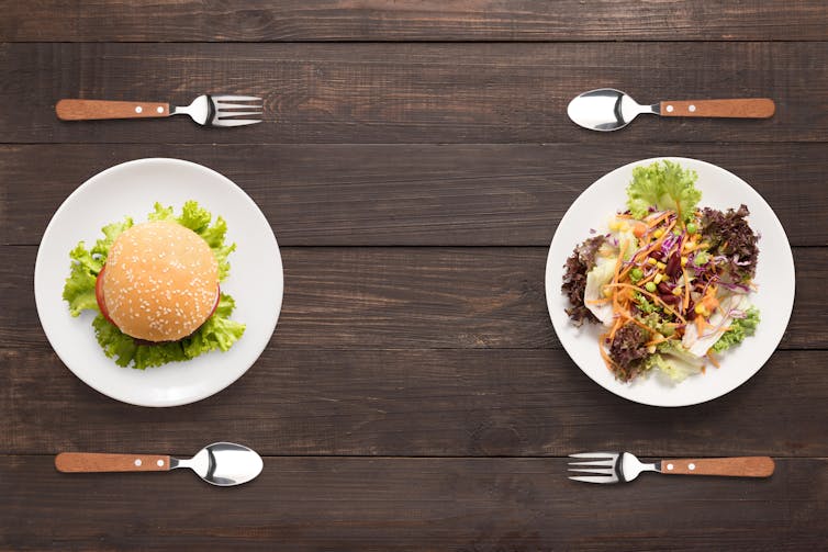 Burger and salad on plates