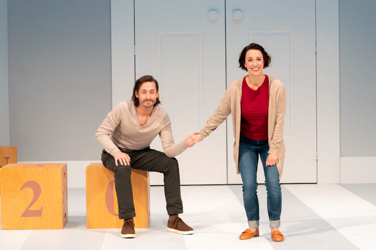 A man and a woman hold hands.