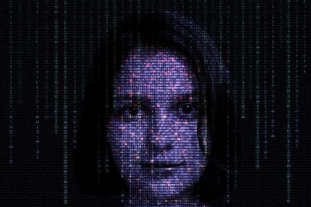 Digitally generated pixelated image of woman's face