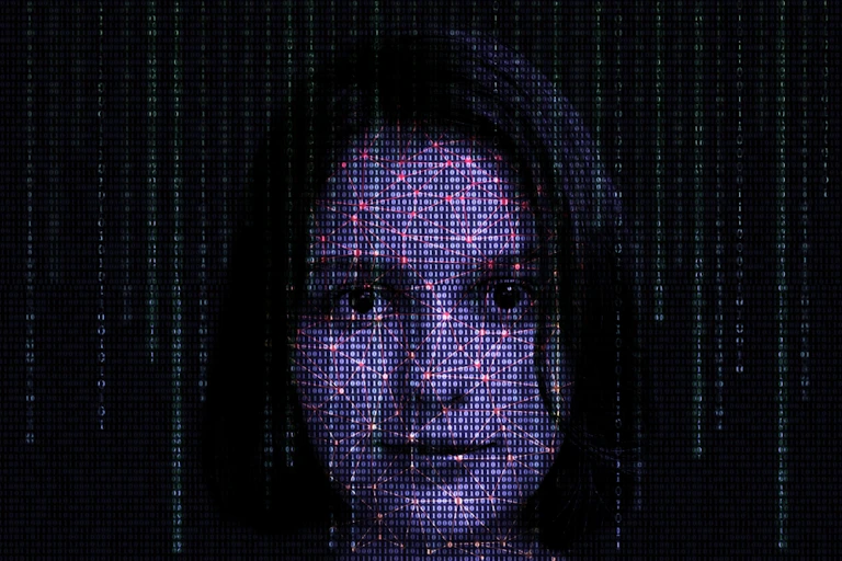 Digitally generated pixelated image of woman's face