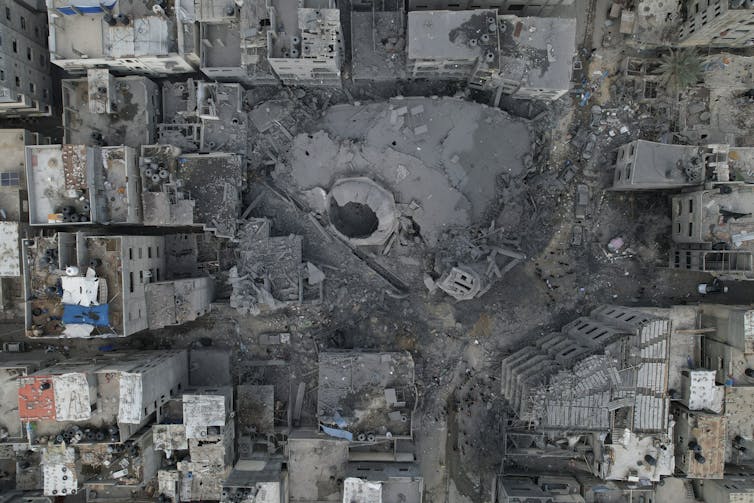 Bird's eye view of buildings destroyed by bombs.