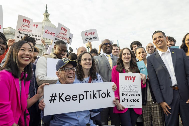 People of all races and ages pose holding signs that read 'Keep TikTok' and 'My small business thrives on TikTok.'