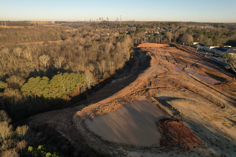 A swath of cleared land in the middle of a forested area