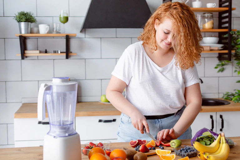 Woman cuts fruit