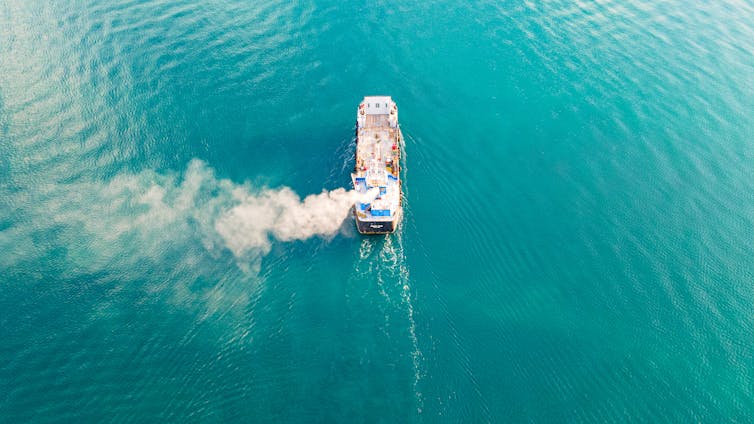 ship from above belching white smoke