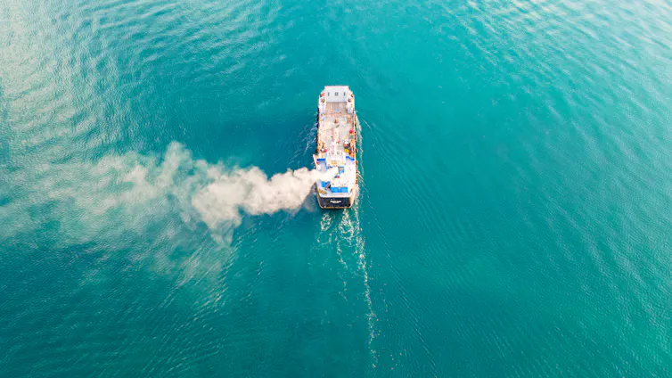 ship from above belching white smoke