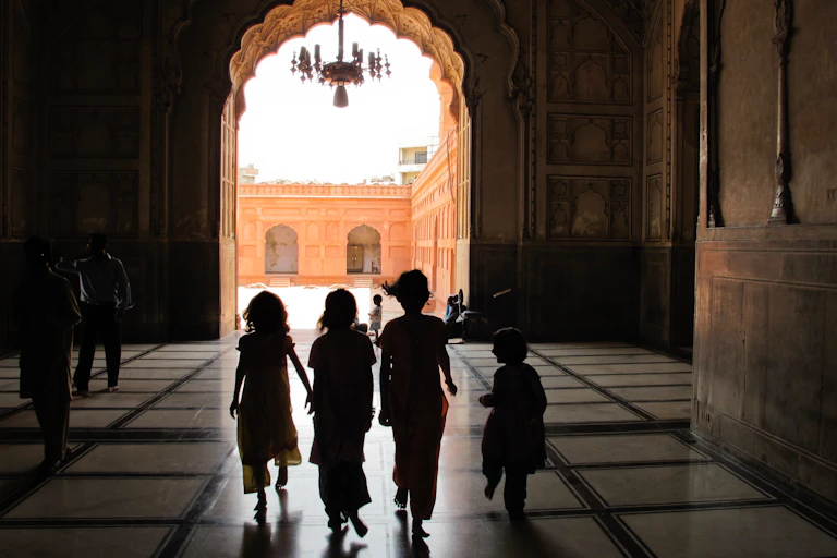 Children walk together in a building in Pakistan