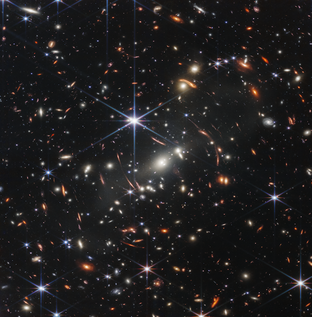 Lots of galaxies shown as small points of light against a dark backdrop.