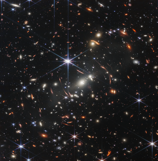 sound cannot travel through space because Lots of galaxies shown as small points of light against a dark backdrop.