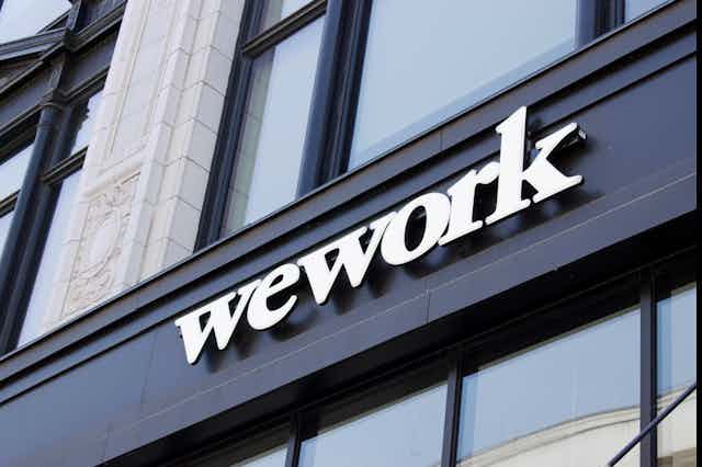 a building sign reading WEWORK