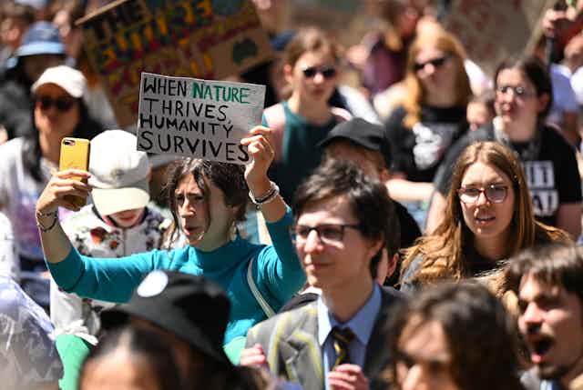 Protesters gather during the School Strike 4 Climate rally at Flagstaff Gardens in Melbourne, November 2023.
