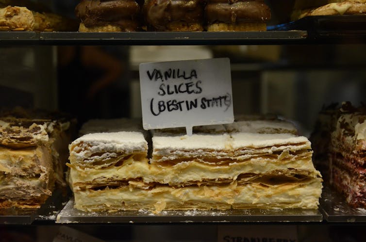 Vanilla slices in a window display.