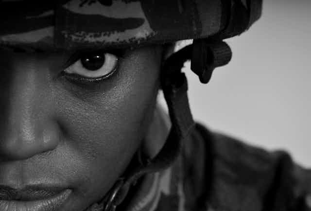 Close up, black and white photo of a female soldier's face