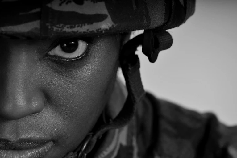 Close up, black and white photo of a female soldier's face