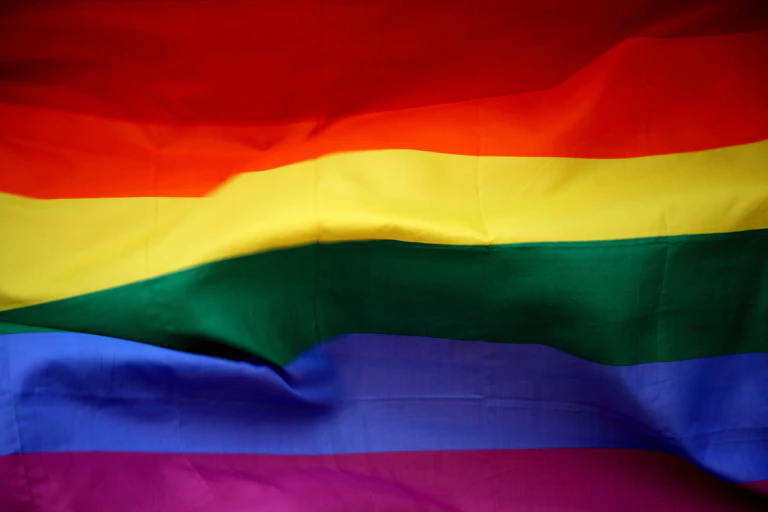 A rainbow flag is shown up close.
