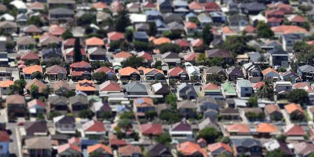 Aerial shot of a suburb with a lens blur and some houses in focus