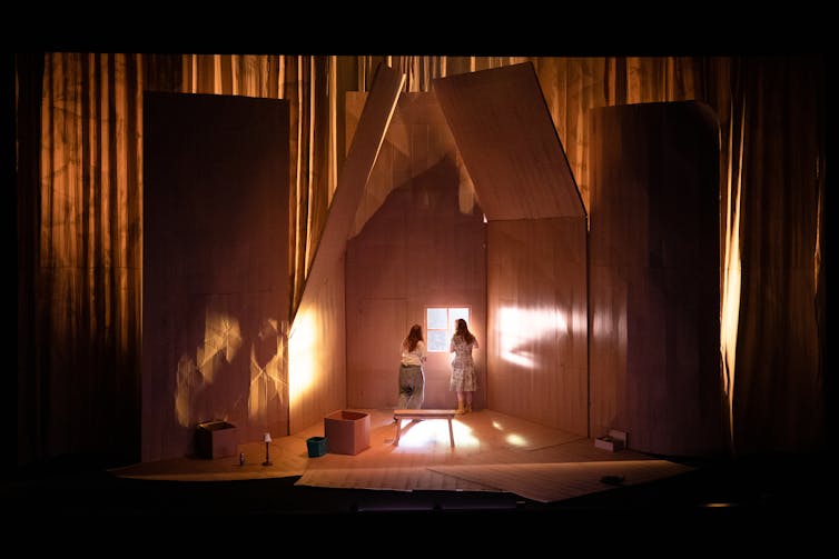The stage, a house built of cardboard.
