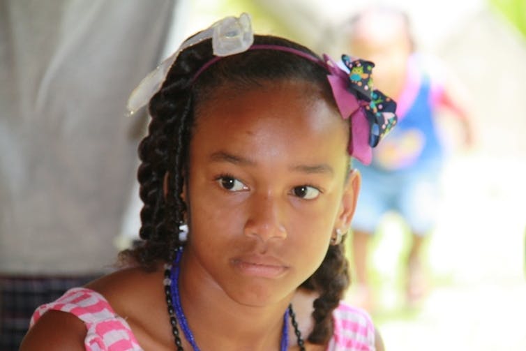 Girl in pink dress with hair band