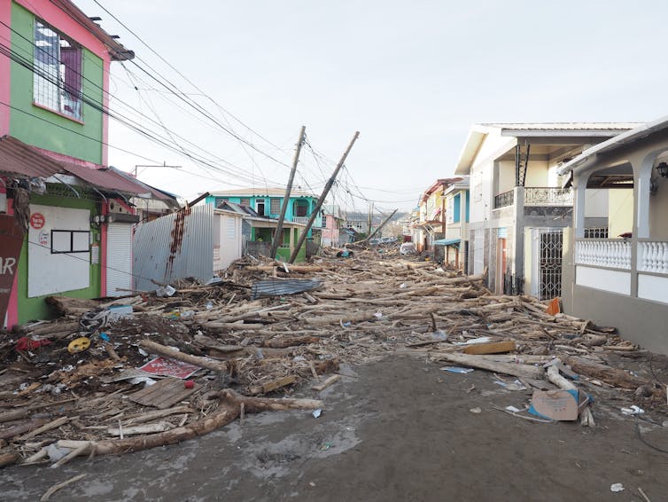 Street with damaged buildings and rubble