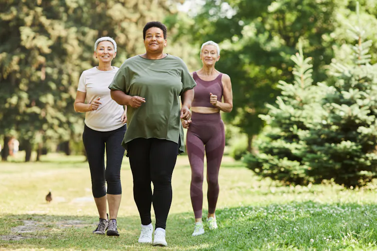 Three women walking in exercise clothes