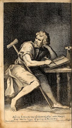A tan and gray illustration of a man in simple clothing, seated with a crutch by his side, writing and looking over his shoulder.