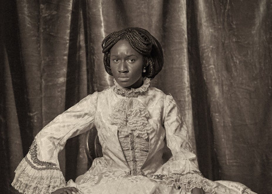 photograph of a black woman dressed in Victorian clothes.