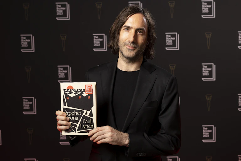 Paul Lynch holds his winning book