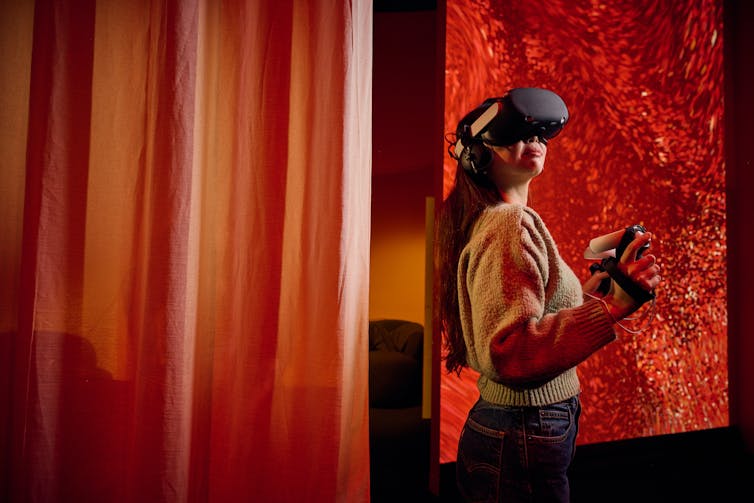 A girl in a VR headset.