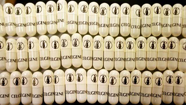 drug capsules show graphic of pregnant woman with cross through it