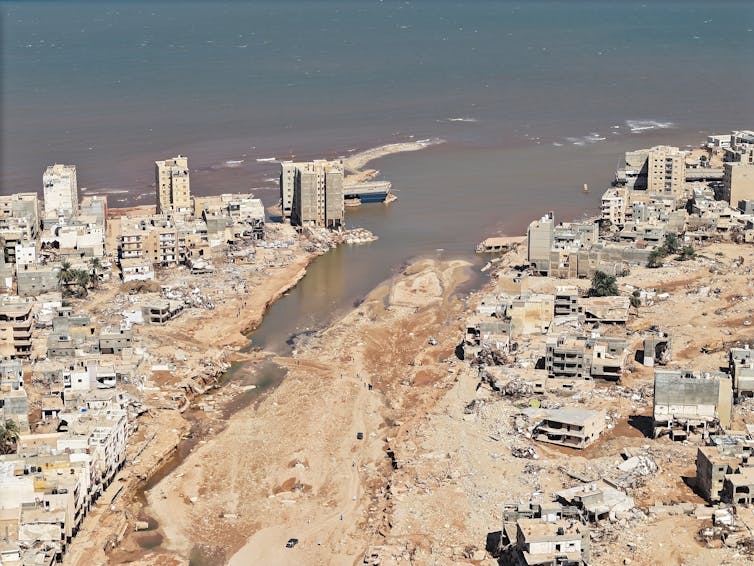 libya flood, image of destroyed city with floodwater from air