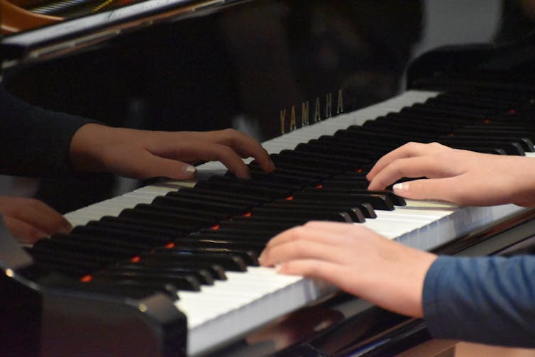 A child plays the piano.