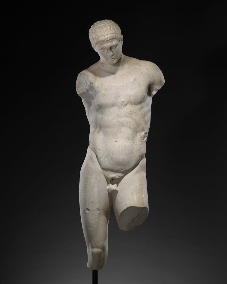 Sculpture of a toned male torso.