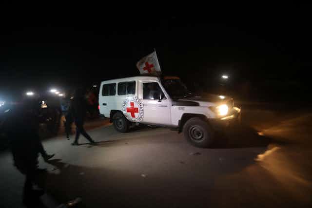 A white van with a Red Cross on it.