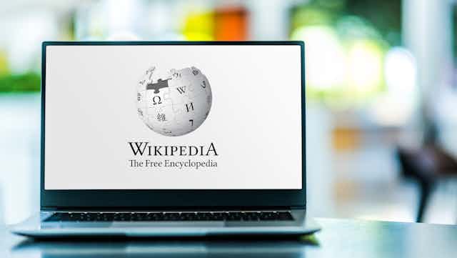 The Wikipedia logo on a laptop