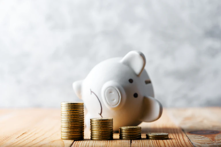 A piggy bank lies tipped on its side.