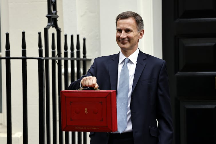 UK chancellor, Jeremy Hunt on the way to deliver his 2023 spring budget.