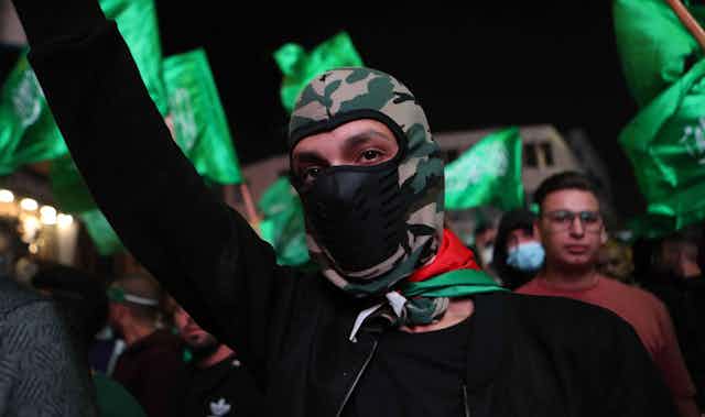 Hamas supporters march as part of a demonstration in Hebron, on the West Bank, October 11 2023.