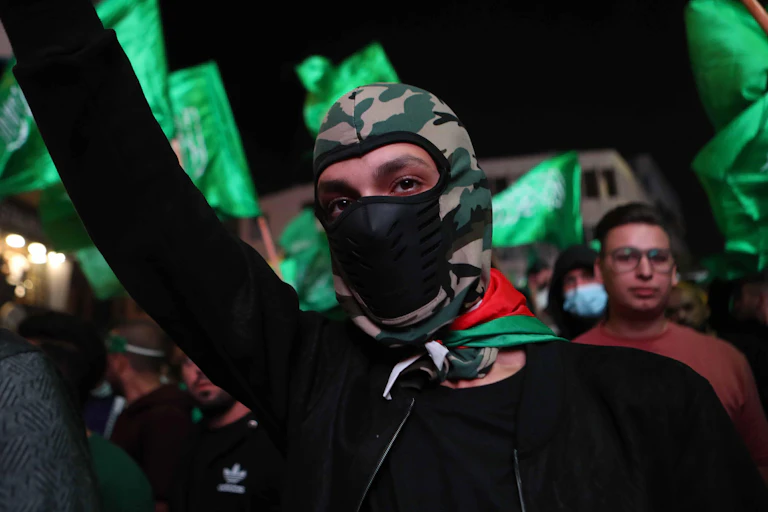 Hamas supporters march as part of a demonstration in Hebron, on the West Bank, October 11 2023.