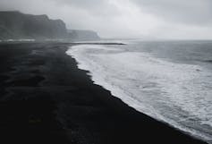 Black and white photo of a beach