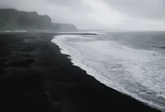 Black and white photo of a beach