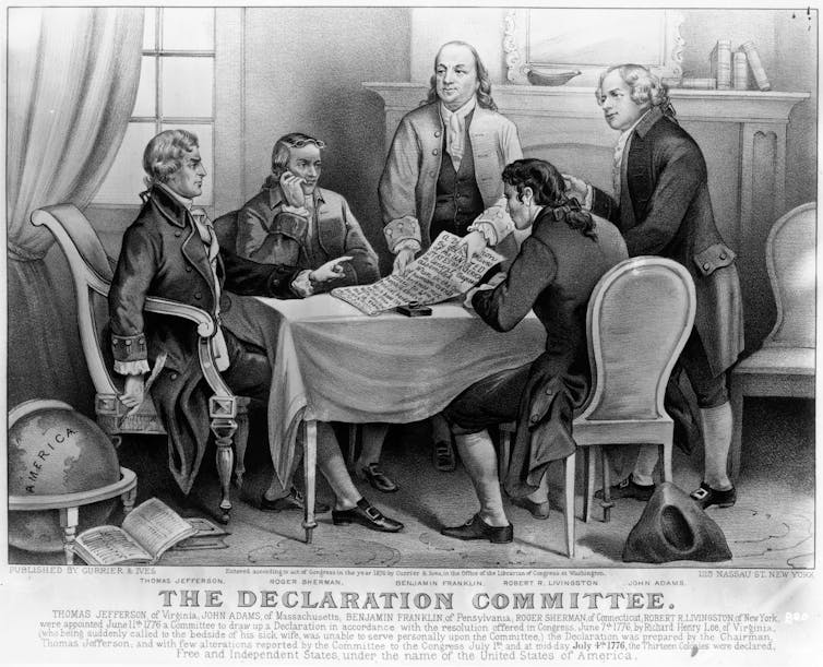 Five men sitting and standing around a table, with the title 'The Declaration Committee' below the image.
