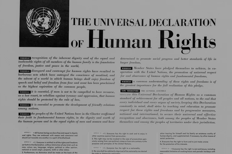 Close-up of text of the Universal Declaration of Human Rights with the United Nations logo on the upper left corner.
