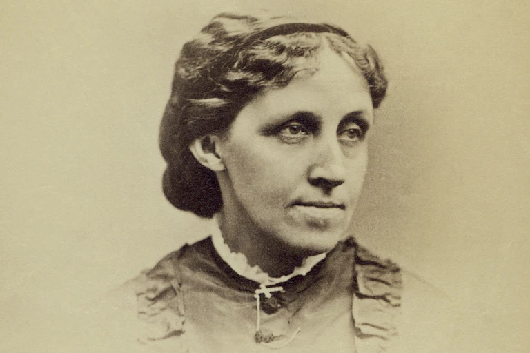 Vignette sepia photographic portrait of young woman made in the 1870s.