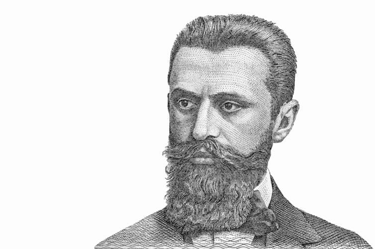 A black and white illustration of a bearded man.
