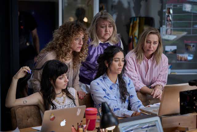 Women around a laptop