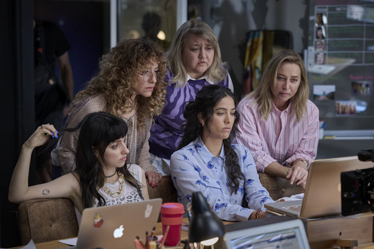 Women around a laptop