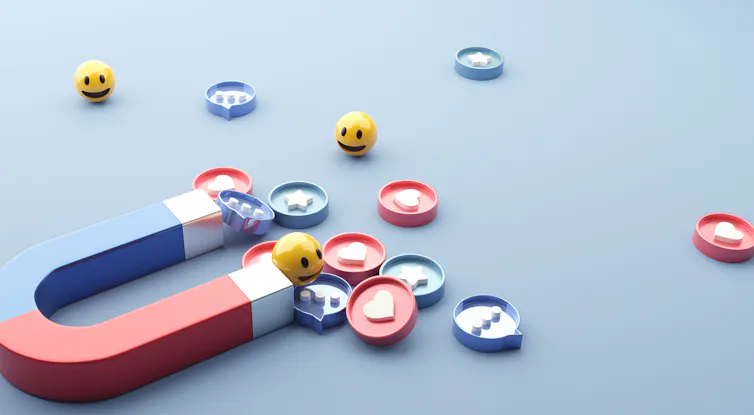 Magnet with icons representing likes, loves, laughs online.