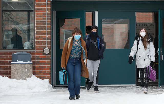 Some high school students at College Louis Riel, walks out of classes in Winnipeg on Monday, January 17, 2022. Some Manitoba students walked out of class to protest the return to school as COVID-19 numbers continue to rise. THE CANADIAN PRESS/John Woods