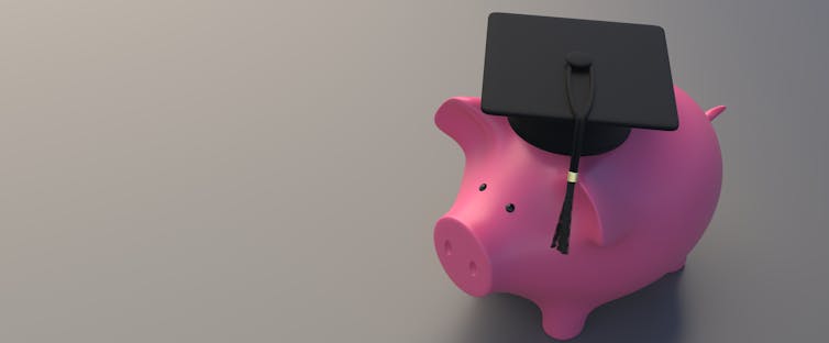 piggy bank wearing a graduation cap